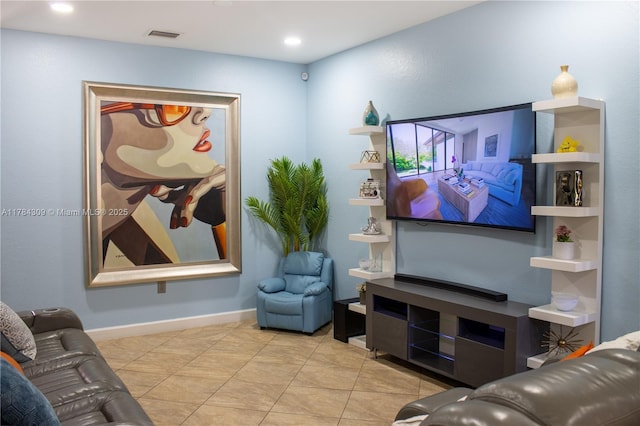 living room with visible vents, baseboards, recessed lighting, and tile patterned flooring