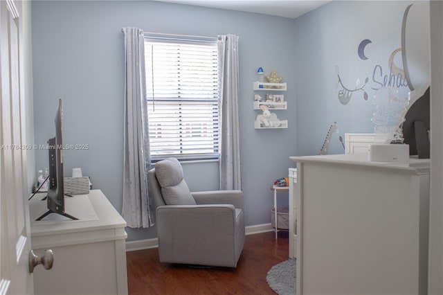 interior space with baseboards, an upstairs landing, and dark wood finished floors
