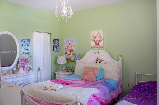 bedroom with a closet and an inviting chandelier