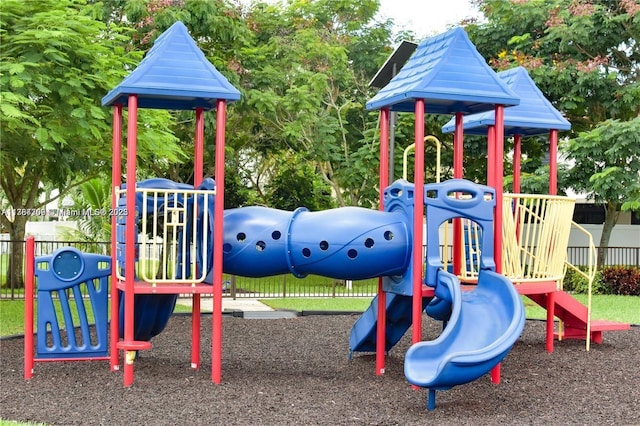community jungle gym featuring fence