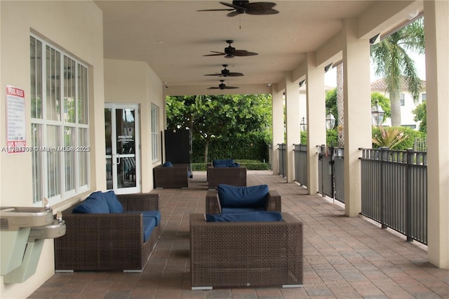 view of patio with outdoor lounge area and a ceiling fan