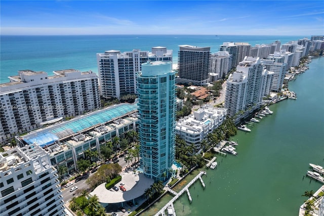 drone / aerial view featuring a water view and a view of city