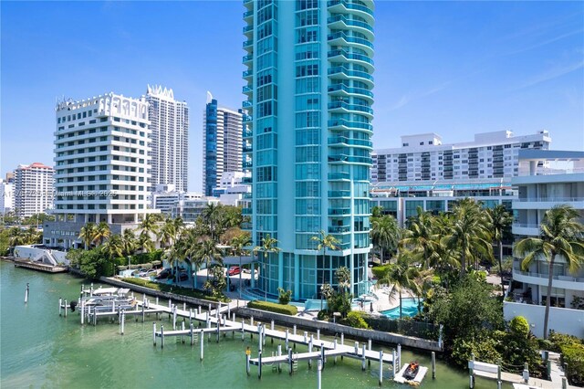 view of building exterior featuring a view of city and a water view