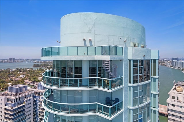 view of property with a view of city and a water view