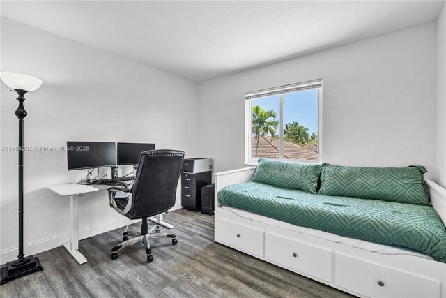 home office with wood finished floors