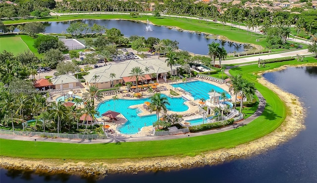 birds eye view of property with a water view
