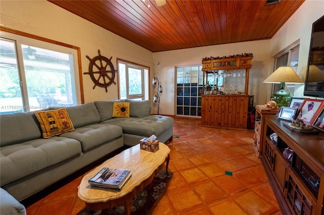 living room with wooden ceiling and light tile patterned floors