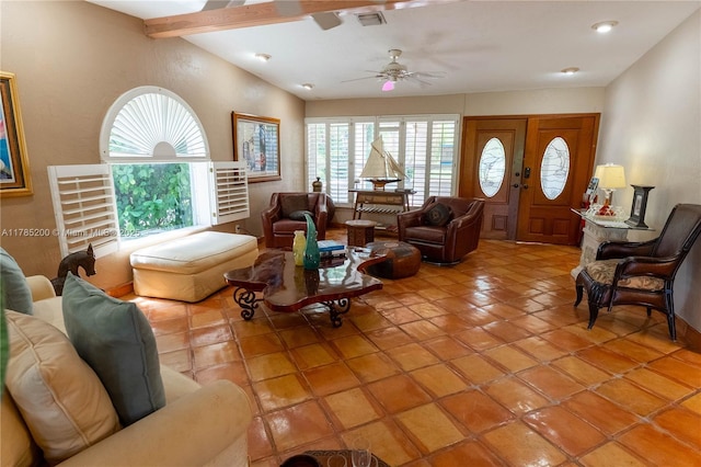 living room featuring healthy amount of natural light, ceiling fan, and light tile patterned floors