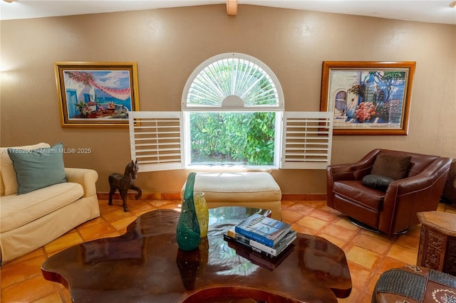 living room with tile patterned flooring