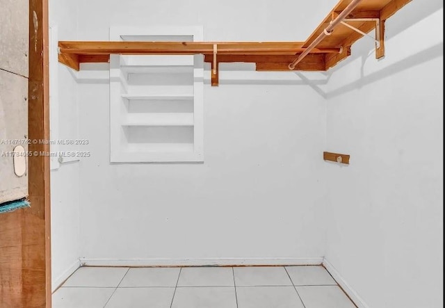 spacious closet with tile patterned flooring