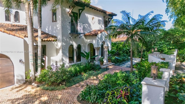 1511 Alegriano Ave, Coral Gables, FL 33146 - view of home's exterior with a balcony, a tiled roof, and stucco siding