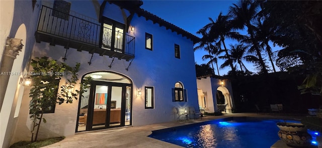 1511 Alegriano Ave, Coral Gables, FL 33146 - pool at night with an outdoor pool and a patio area