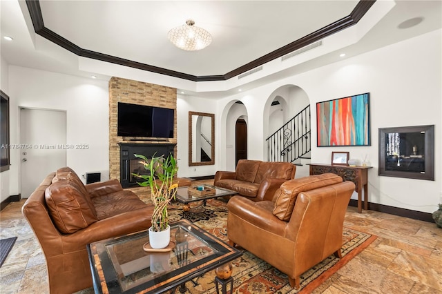 1511 Alegriano Ave, Coral Gables, FL 33146 - living room featuring stone tile flooring, a raised ceiling, baseboards, stairway, and ornamental molding