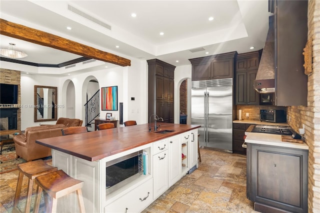 1511 Alegriano Ave, Coral Gables, FL 33146 - kitchen with visible vents, recessed lighting, appliances with stainless steel finishes, open floor plan, and wood counters