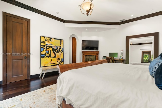 1511 Alegriano Ave, Coral Gables, FL 33146 - bedroom featuring recessed lighting, arched walkways, dark wood-style floors, and ornamental molding