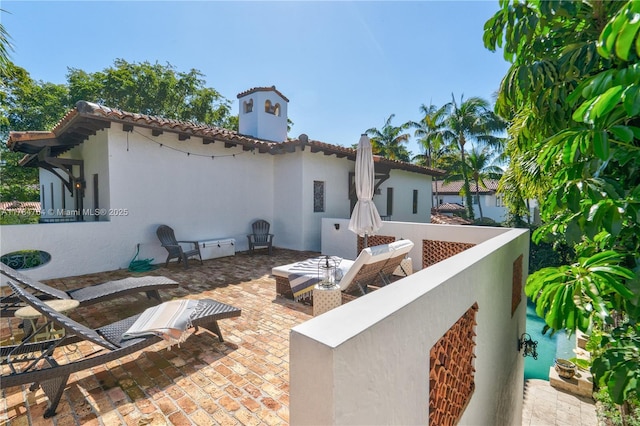 1511 Alegriano Ave, Coral Gables, FL 33146 - back of house with a patio area, a tile roof, and stucco siding