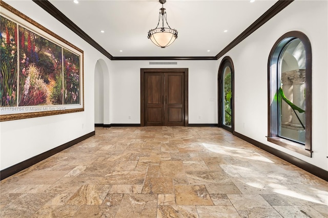 1511 Alegriano Ave, Coral Gables, FL 33146 - unfurnished room with baseboards, arched walkways, ornamental molding, recessed lighting, and stone tile floors