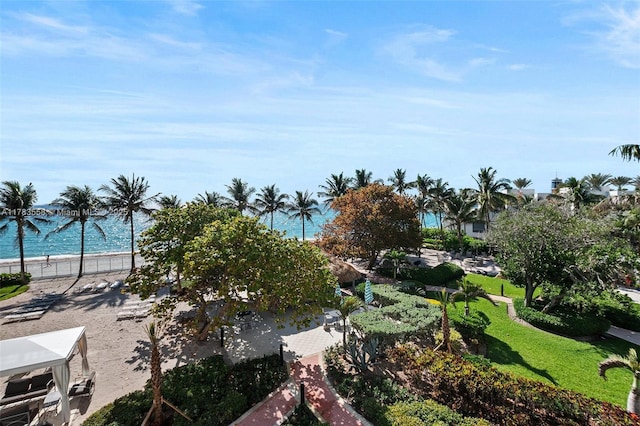 view of home's community featuring a yard and a water view