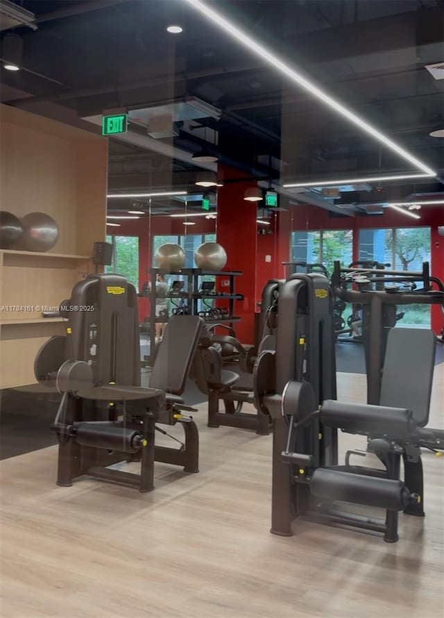 workout area with wood finished floors