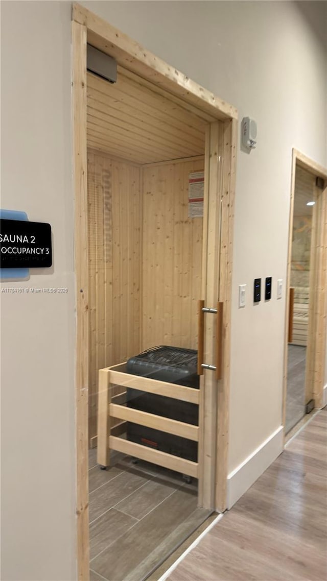 view of sauna featuring wood finished floors