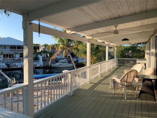 wooden deck featuring a ceiling fan