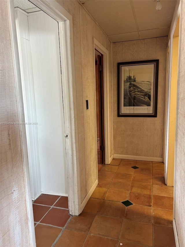 hall featuring tile patterned flooring