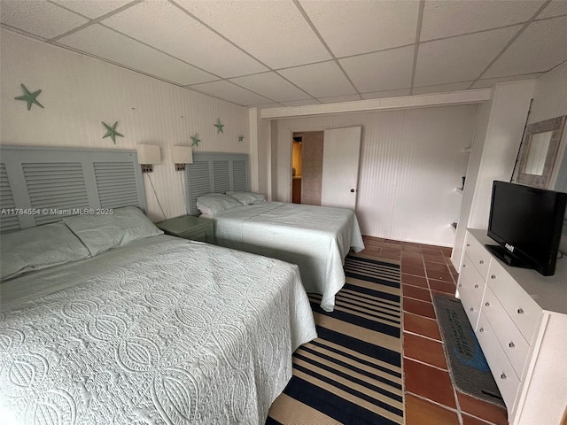 bedroom with a paneled ceiling