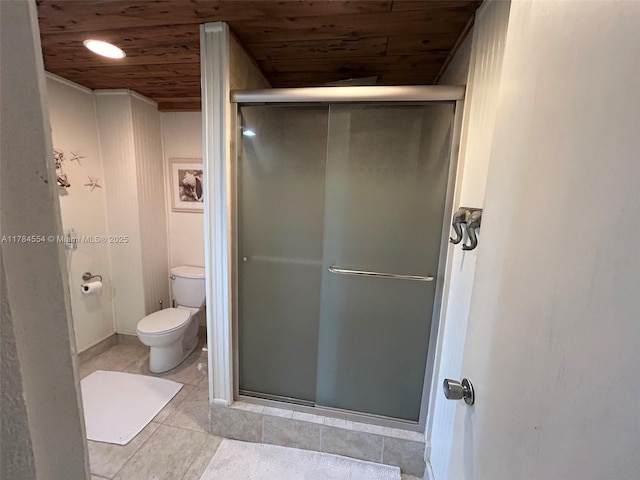 full bathroom with toilet, wooden ceiling, a shower stall, and tile patterned flooring