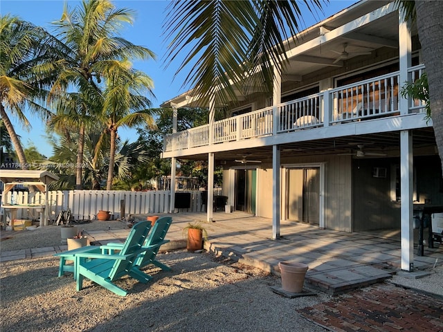 exterior space featuring fence, a balcony, and a patio area