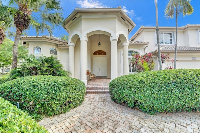 1951 NW 167th Ter, Pembroke Pines, FL 33028 - view of front of home featuring a garage and stucco siding
