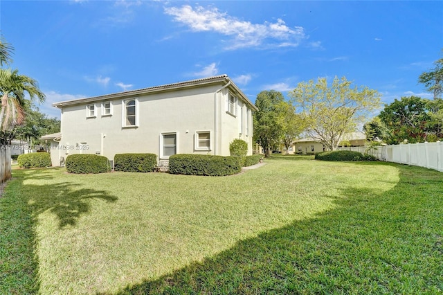 1951 NW 167th Ter, Pembroke Pines, FL 33028 - view of side of home featuring fence, a yard, and stucco siding