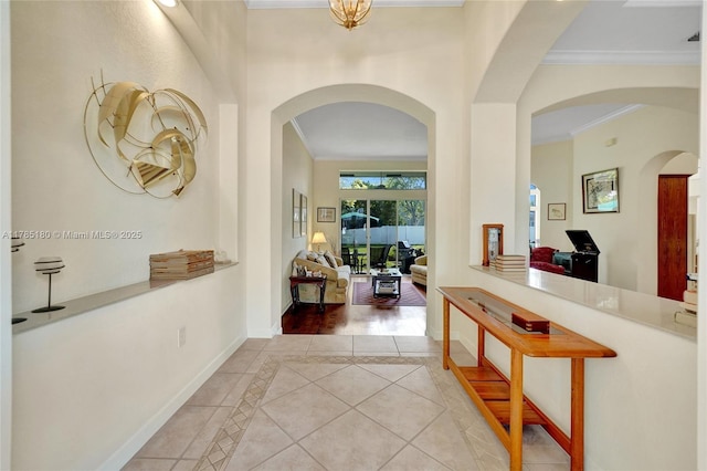1951 NW 167th Ter, Pembroke Pines, FL 33028 - corridor featuring tile patterned floors, baseboards, arched walkways, and ornamental molding