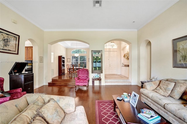 1951 NW 167th Ter, Pembroke Pines, FL 33028 - living area with arched walkways, ornamental molding, wood finished floors, and visible vents