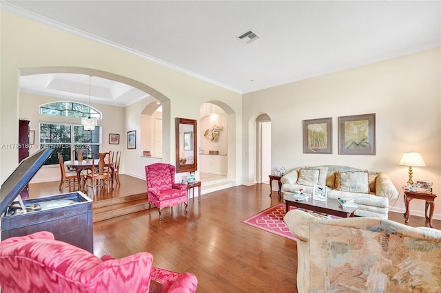 1951 NW 167th Ter, Pembroke Pines, FL 33028 - living room with a chandelier, arched walkways, wood-type flooring, baseboards, and visible vents