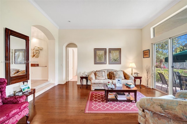 1951 NW 167th Ter, Pembroke Pines, FL 33028 - living area with hardwood / wood-style floors, arched walkways, and crown molding