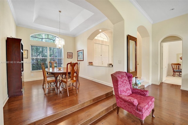1951 NW 167th Ter, Pembroke Pines, FL 33028 - dining space with crown molding, baseboards, a notable chandelier, and wood-type flooring