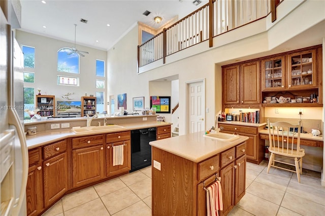 1951 NW 167th Ter, Pembroke Pines, FL 33028 - kitchen featuring black dishwasher, a towering ceiling, brown cabinets, and a sink