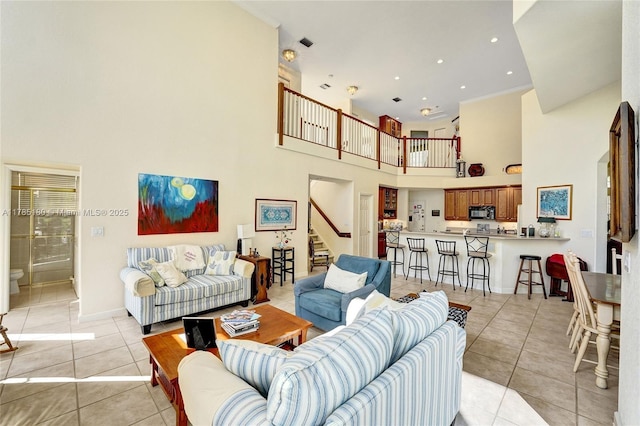 1951 NW 167th Ter, Pembroke Pines, FL 33028 - living area with recessed lighting, stairway, a towering ceiling, light tile patterned floors, and baseboards