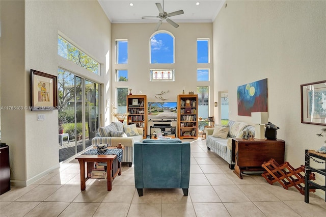 1951 NW 167th Ter, Pembroke Pines, FL 33028 - living area featuring a ceiling fan, light tile patterned floors, a towering ceiling, baseboards, and ornamental molding