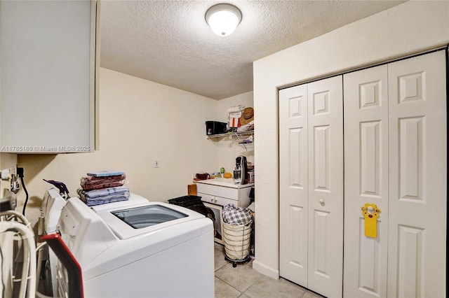 1951 NW 167th Ter, Pembroke Pines, FL 33028 - laundry room with washing machine and dryer, a textured ceiling, laundry area, and light tile patterned floors