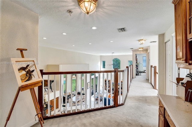 1951 NW 167th Ter, Pembroke Pines, FL 33028 - corridor featuring light carpet, a textured ceiling, visible vents, and recessed lighting