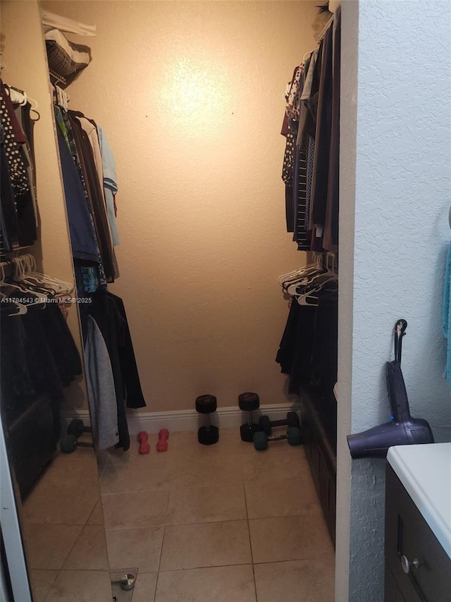 13799 SW 147th Cir Ln Unit 3, Miami, FL 33186 - walk in closet featuring light tile patterned floors