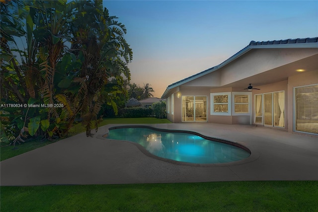 11257 NW 51st St, Coral Springs, FL 33076 - pool at dusk with an outdoor pool, a patio, and a ceiling fan