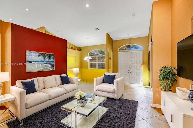 11257 NW 51st St, Coral Springs, FL 33076 - living room featuring a chandelier, recessed lighting, light tile patterned floors, and vaulted ceiling