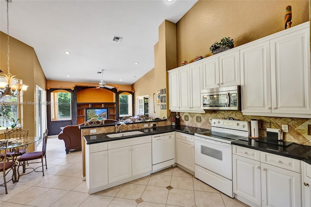 11257 NW 51st St, Coral Springs, FL 33076 - kitchen with a sink, open floor plan, tasteful backsplash, and white appliances