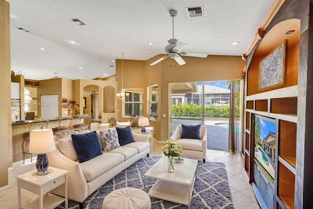 11257 NW 51st St, Coral Springs, FL 33076 - living room with lofted ceiling, recessed lighting, visible vents, ceiling fan, and arched walkways