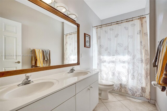 11257 NW 51st St, Coral Springs, FL 33076 - full bath with toilet, double vanity, a sink, and tile patterned flooring
