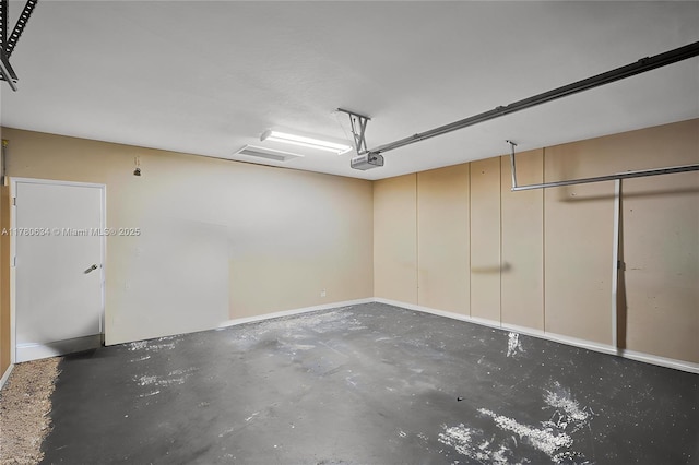 11257 NW 51st St, Coral Springs, FL 33076 - garage with baseboards and a garage door opener