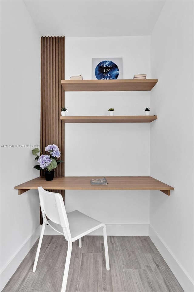 details with wood finished floors and baseboards