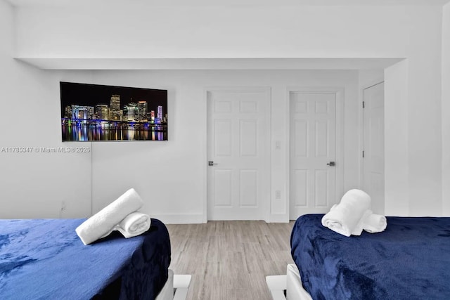bedroom with light wood-style floors